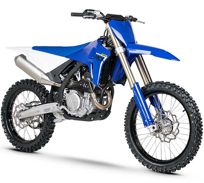 Blue and white ZX Moto motocross bike with gold forks, spoked wheels and knobbly tyres.