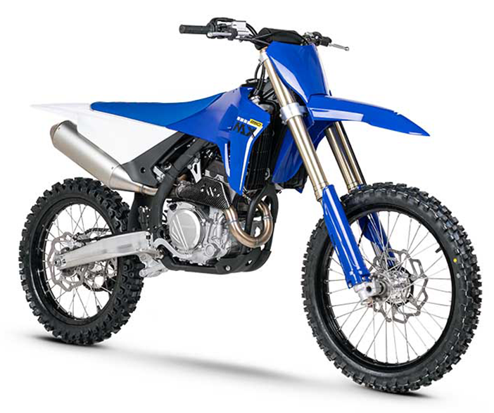 Blue and white ZXMOTO motocross motorcycle with gold front forks and a silver exhaust, angled right.