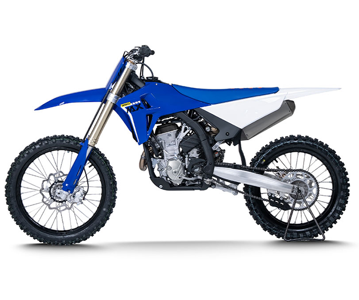 Left-facing side profile of a blue and white ZXMOTO motocross motorcycle with an exposed engine and silver swingarm.