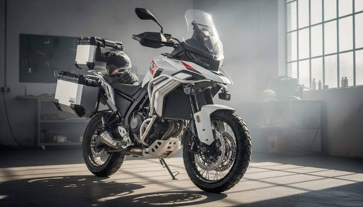 White ZXMOTO 820X fitted with aluminium panniers and a top box in a sunlit workshop.